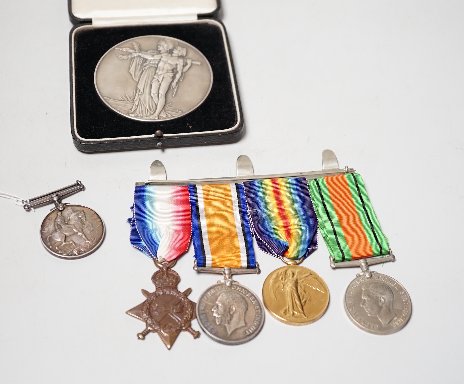 A World War I/World War II group of four Medals to M2–101459 PTE. J. Bourne. A.S.C., A war medal two second lieutenant J D Head and An Opening of the Cenotaph large silver medal, 75 mm